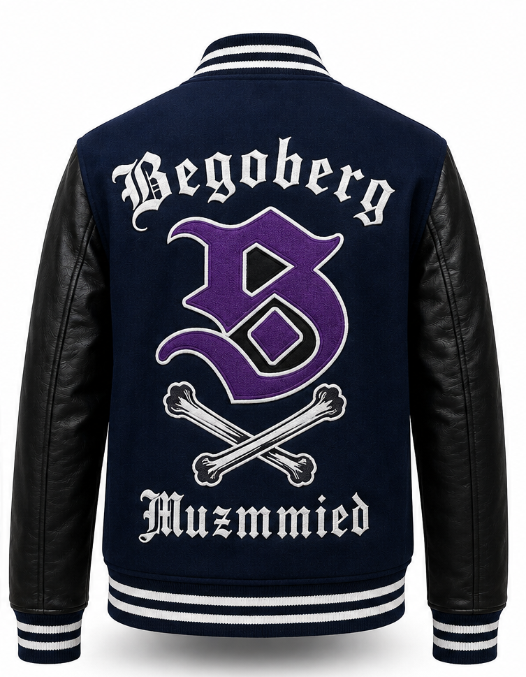 Back view of a varsity-style jacket with a navy blue body, black faux-leather sleeves, and white and purple embroidery reading 'Begoberg' and 'Muzmmied' with a large purple letter B and crossed bones.