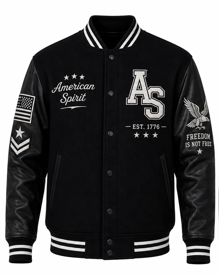 Black varsity jacket with black leather sleeves, featuring white embroidered graphics including 'American Spirit', 'AS', 'FREEDOM IS NOT FREE', an eagle, and military-style chevrons on the sleeves.
