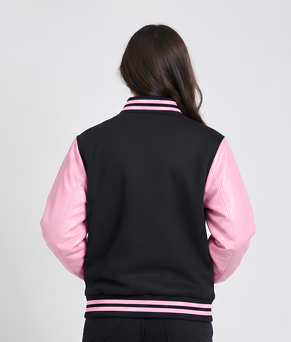 Person wearing a black and pink varsity jacket on a white background