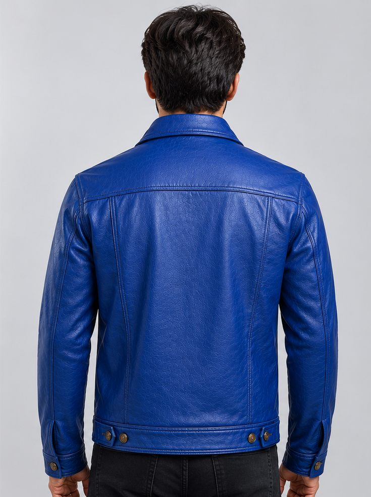 A man viewed from the back wearing a bright royal blue leather trucker jacket, shown against a plain light gray studio background.