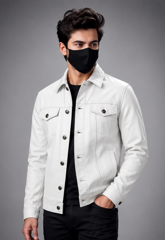 A man wearing a white leather trucker jacket over a black T-shirt and black pants, wearing a black face mask, photographed against a solid gray studio background.