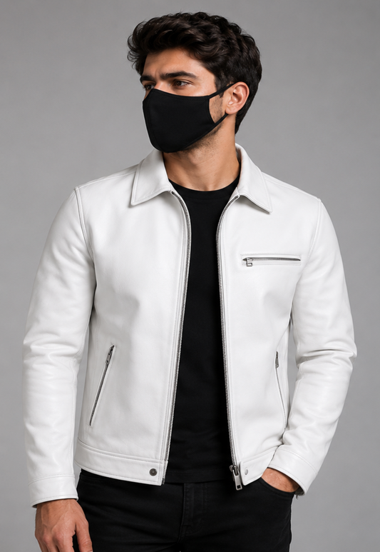 A man wearing a white leather biker jacket wearing a black face mask, photographed against a solid gray studio background.