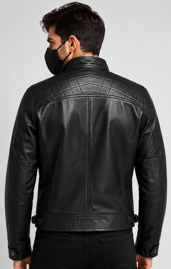 A man wearing a black leather jacket, shown from the back. The jacket features quilted paneling across the upper back and shoulders, a high collar, and a zippered back.