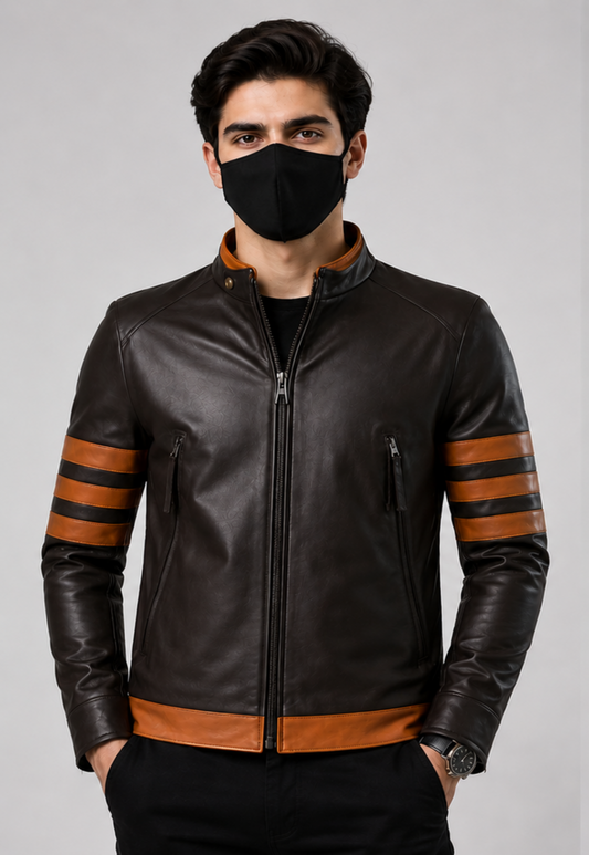 A man wearing a dark brown leather jacket with brown stripe accents on the sleeves and hem, paired with a black face mask and black pants, against a plain gray studio background.