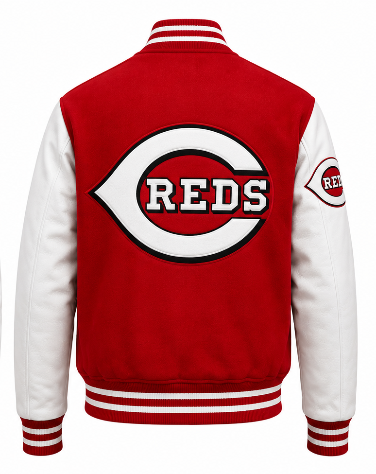 Red and white varsity jacket with the Cincinnati Reds logo on the back, featuring a red body, white sleeves, and striped ribbed collar, cuffs, and hem.