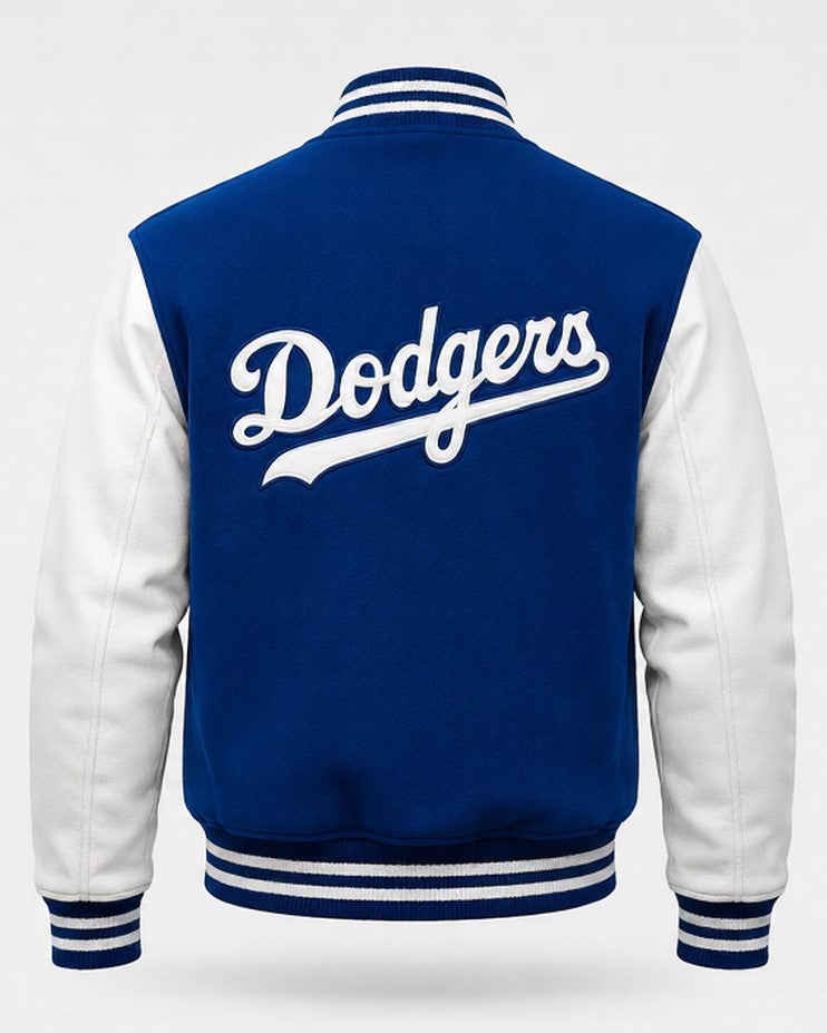 A classic varsity jacket shown from the back, featuring a royal blue body and white sleeves, with 'Dodgers' written in white script across the upper back. The jacket has striped ribbed collar, cuffs, and hem.
