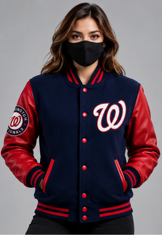 A woman wearing a navy and red Washington Nationals varsity jacket with a black face mask, shown against a plain gray studio background.