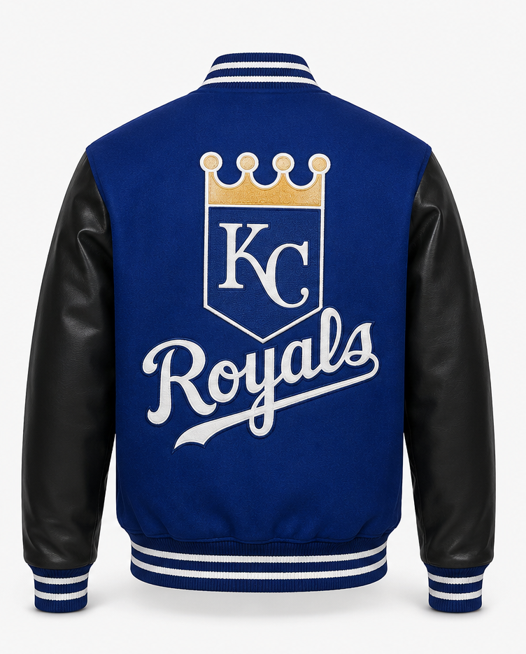 A Kansas City Royals varsity-style jacket shown from the back, featuring a royal blue body, black faux-leather sleeves, and a large white and gold KC Royals crest on the back.