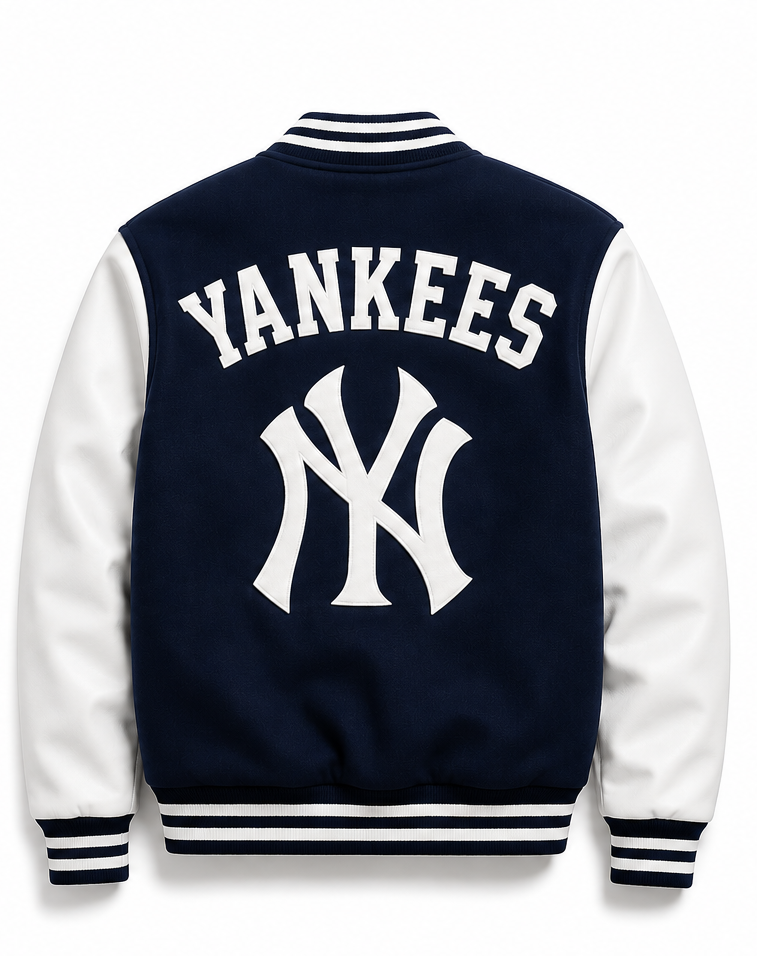 Back view of a navy blue and white varsity jacket featuring 'YANKEES' and the New York Yankees 'NY' logo in white on the back, with white sleeves and striped ribbed collar, cuffs, and hem.
