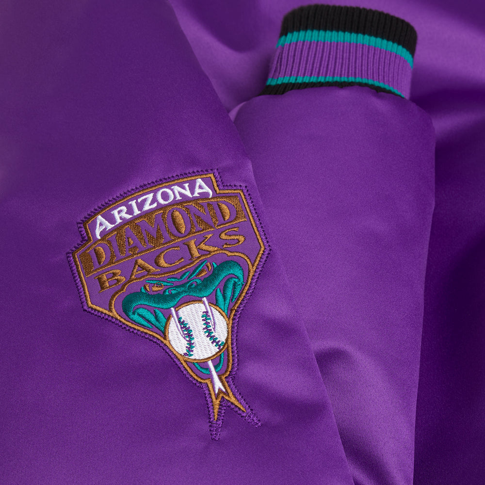 Close-up of a purple jacket with an Arizona Diamondbacks logo.