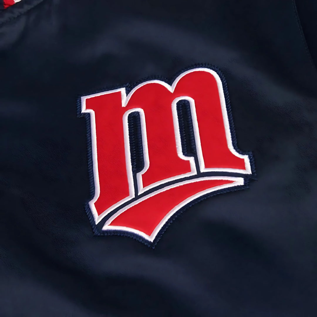 Red 'm' logo on a dark background