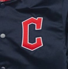 Close-up of a navy baseball jacket with large red letter C embroidery outlined in white on the chest.