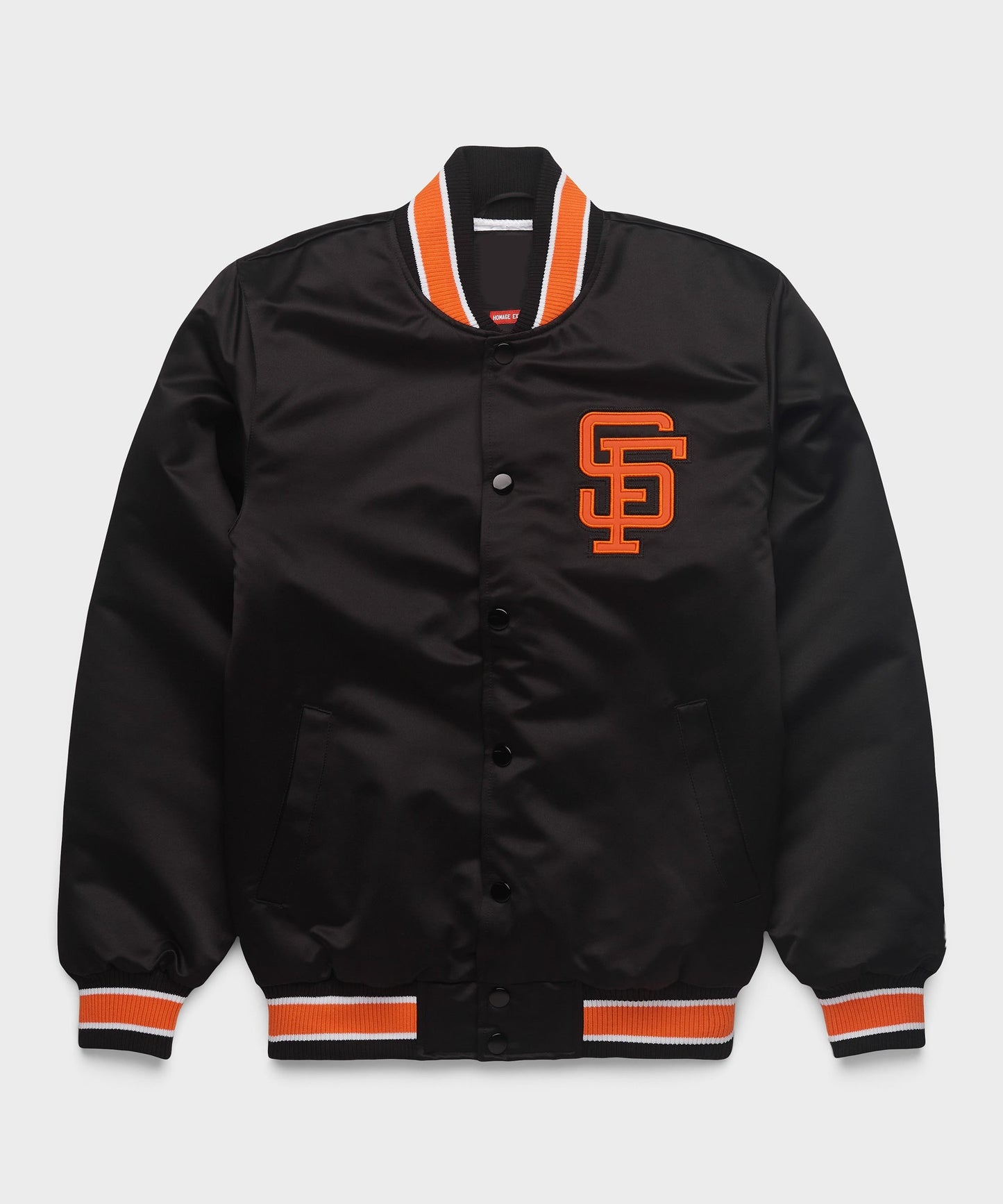 A dark brown satin varsity jacket with orange-and-white striped ribbed trim at the collar, cuffs, and hem, featuring an orange-embroidered 'SF' logo on the left chest. The jacket is displayed flat against a light gray background.