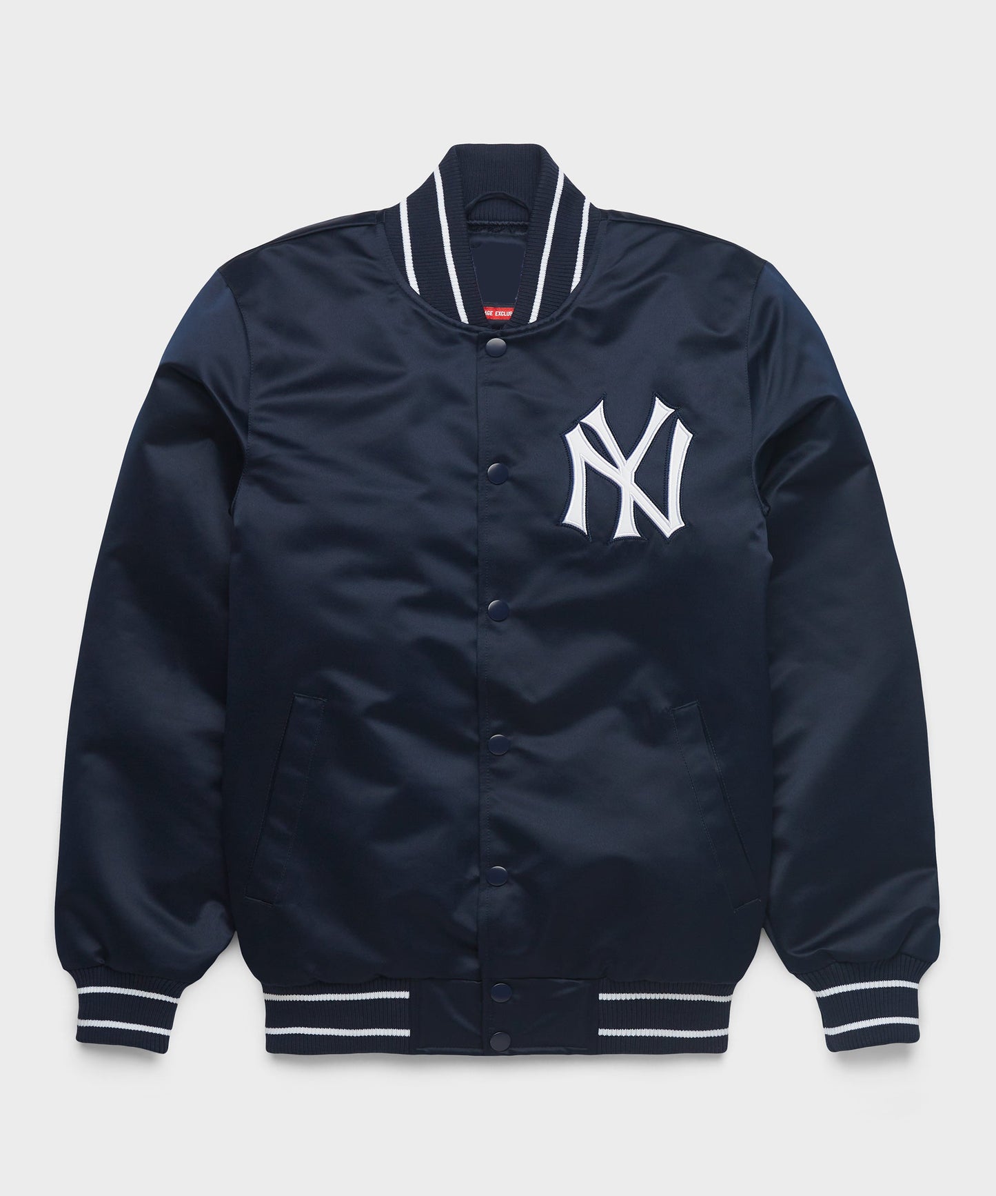 A navy blue satin varsity jacket featuring the white New York Yankees logo on the chest, with white and black striped ribbed collar, cuffs, and hem.