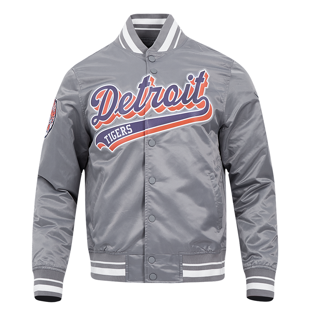 A gray satin varsity jacket featuring embroidered 'Detroit Tigers' lettering in navy blue with orange and white outlines across the chest, set against a plain white background.