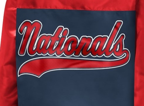 A close-up of a sports jacket or banner featuring a navy blue central panel with the word 'Nationals' in red script with a white outline, surrounded by red fabric.