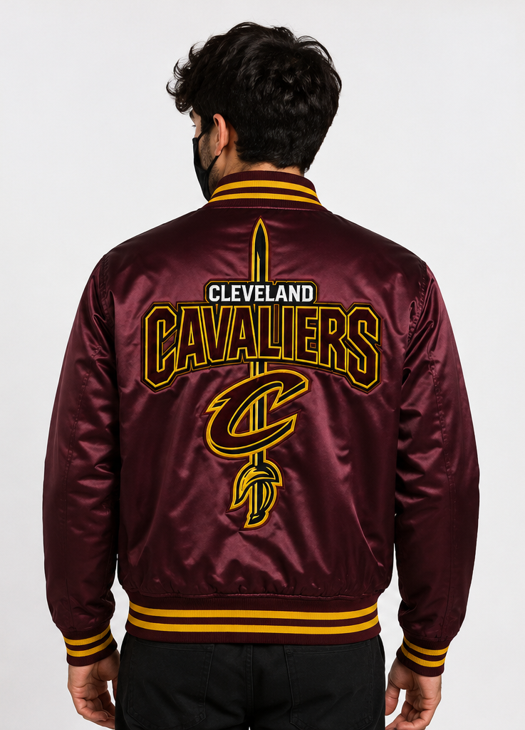 A man viewed from behind wearing a maroon satin bomber jacket with 'CLEVELAND CAVALIERS' and a large 'C' logo printed on the back in gold and white, set against a plain light gray background.