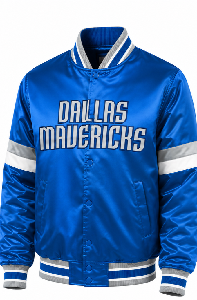 A royal blue satin varsity-style jacket with 'DALLAS MAVERICKS' printed across the chest in white and gray, featuring white and gray stripes on the collar, cuffs, hem, and sleeves.