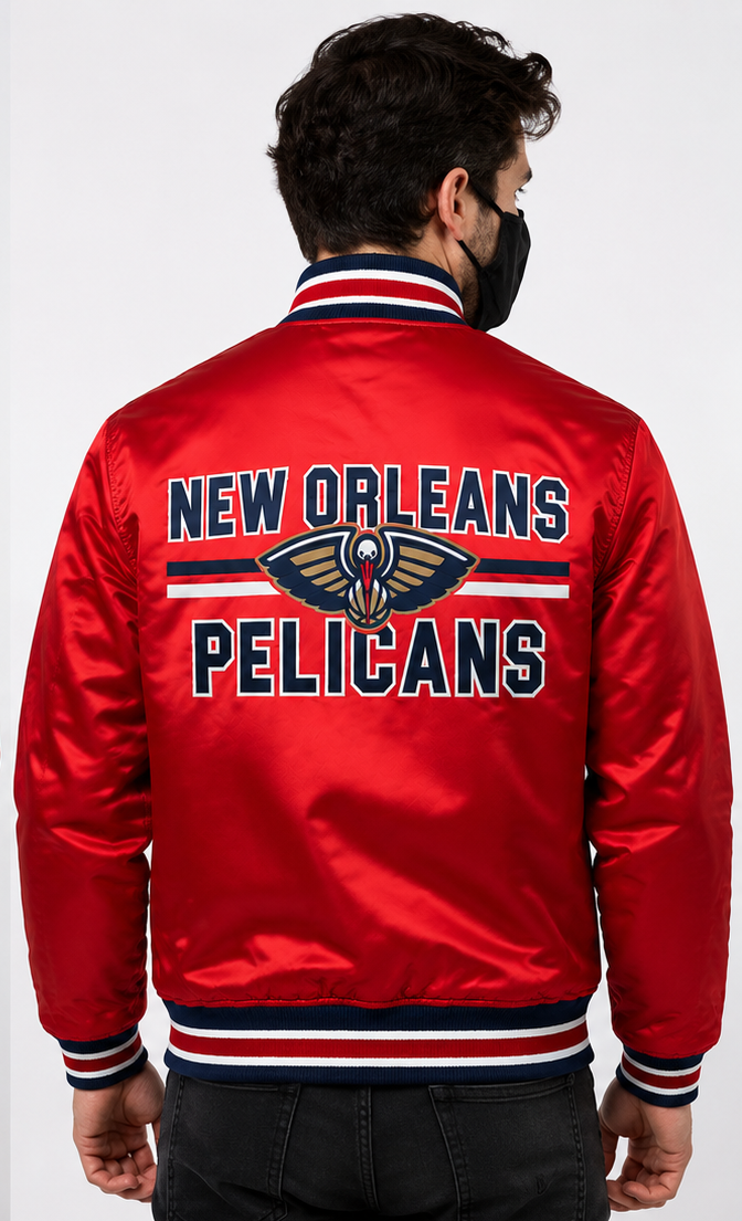 A man viewed from behind wearing a red satin bomber jacket with 'NEW ORLEANS PELICANS' and the team logo embroidered on the back. The jacket has navy and white ribbed collar, cuffs, and hem.