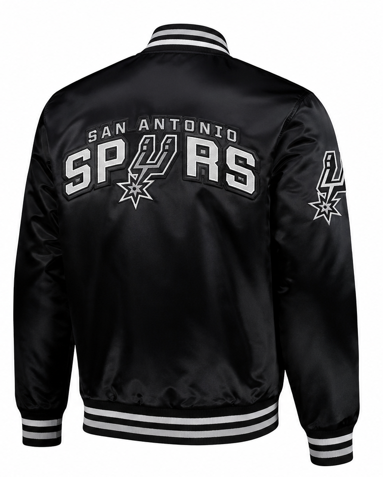 Black satin San Antonio Spurs varsity jacket shown from the back, featuring large white and silver 'SPURS' lettering with the team logo, and matching sleeve embroidery, on a white background.