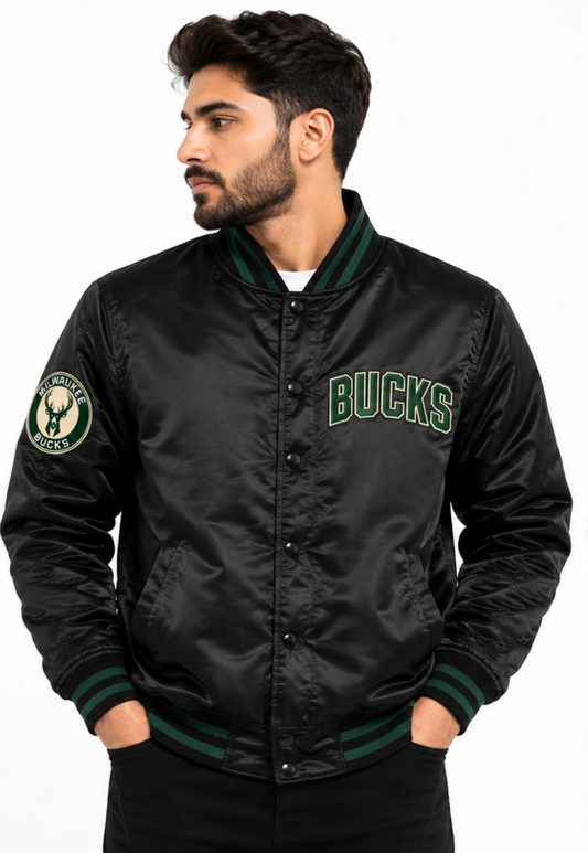 A man wearing a black Milwaukee Bucks satin bomber jacket with green ribbed trim and 'BUCKS' lettering on the chest, photographed against a plain white background.