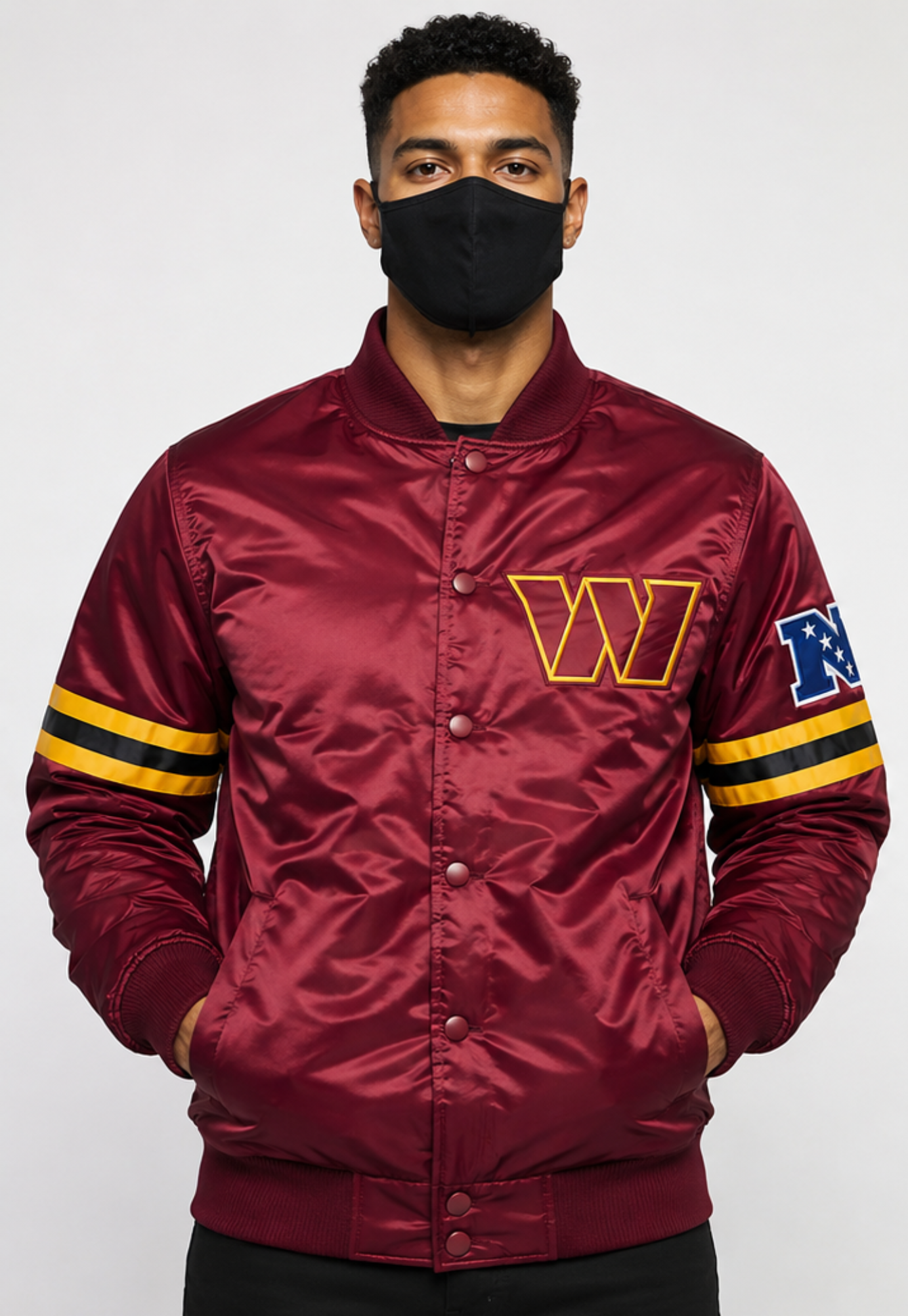 Person wearing a maroon satin jacket, Washington Commanders with logos on a white background