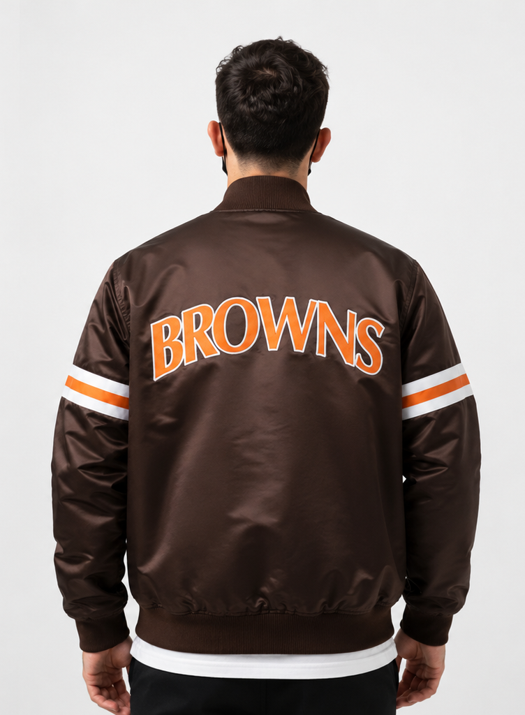 Person wearing a Cleveland brown 'BROWNS' jacket with orange and white lettering on a plain background
