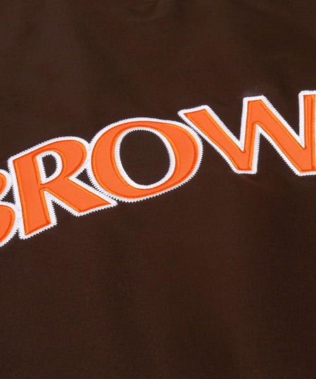 Cleveland Browns: Close-up of brown fabric with orange lettering spelling 'BROWNS'.