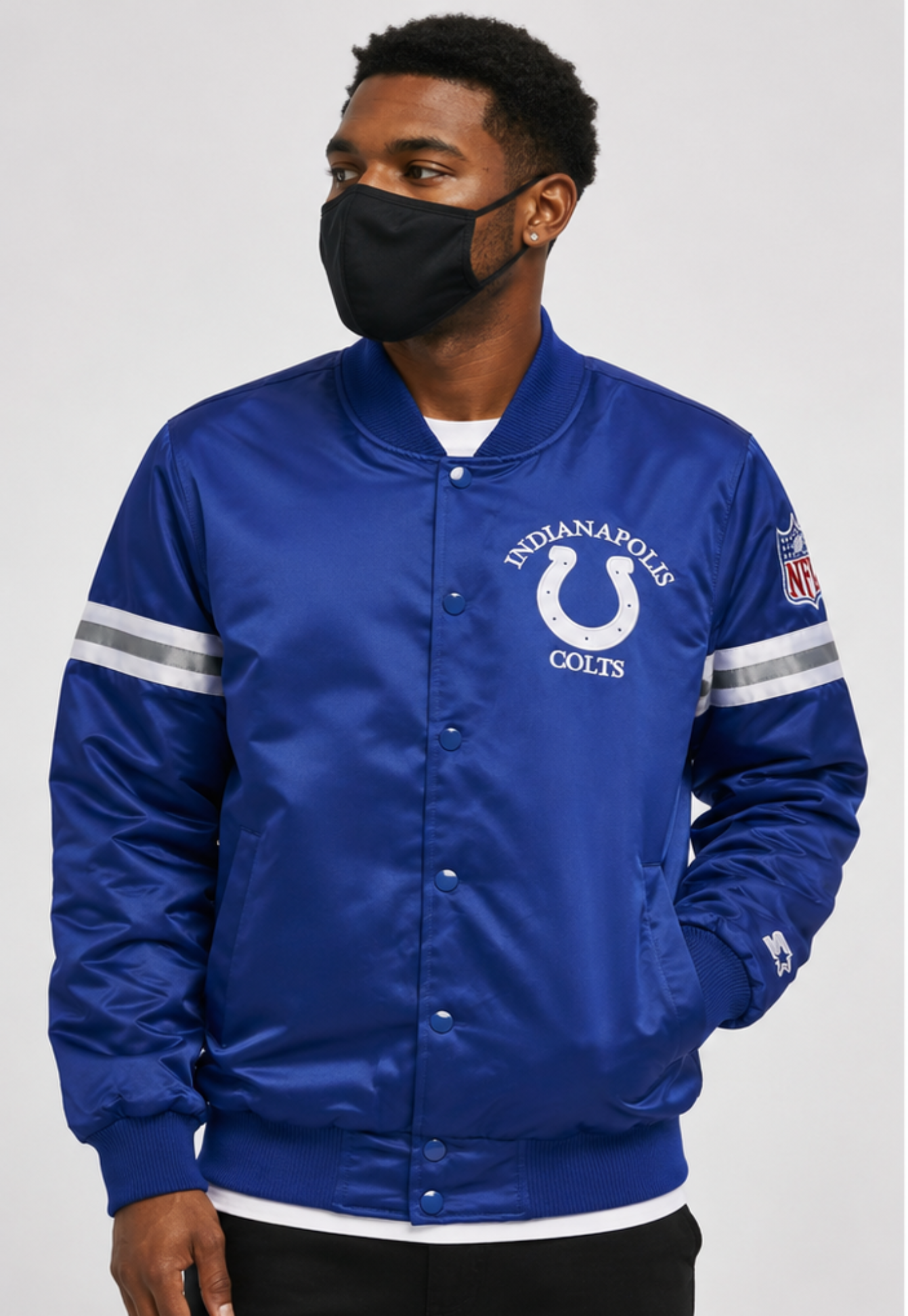 Person wearing a blue Indianapolis Colts jacket with a white logo on a plain background