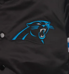 Black jacket with Carolina Panthers logo on a dark background