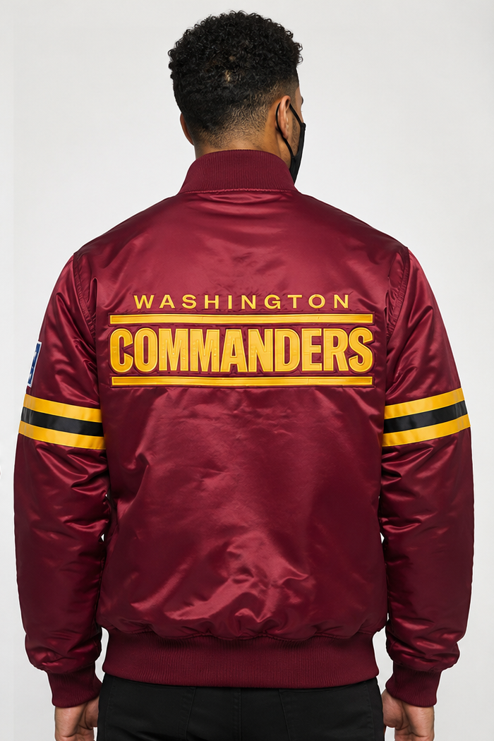 Maroon bomber jacket with 'Washington Commanders' text on the back, worn by a person.