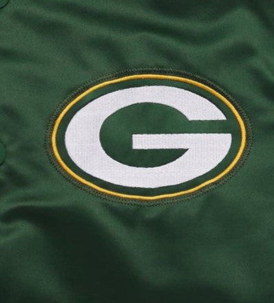 Close-up of a Green Bay Packers logo on a green background