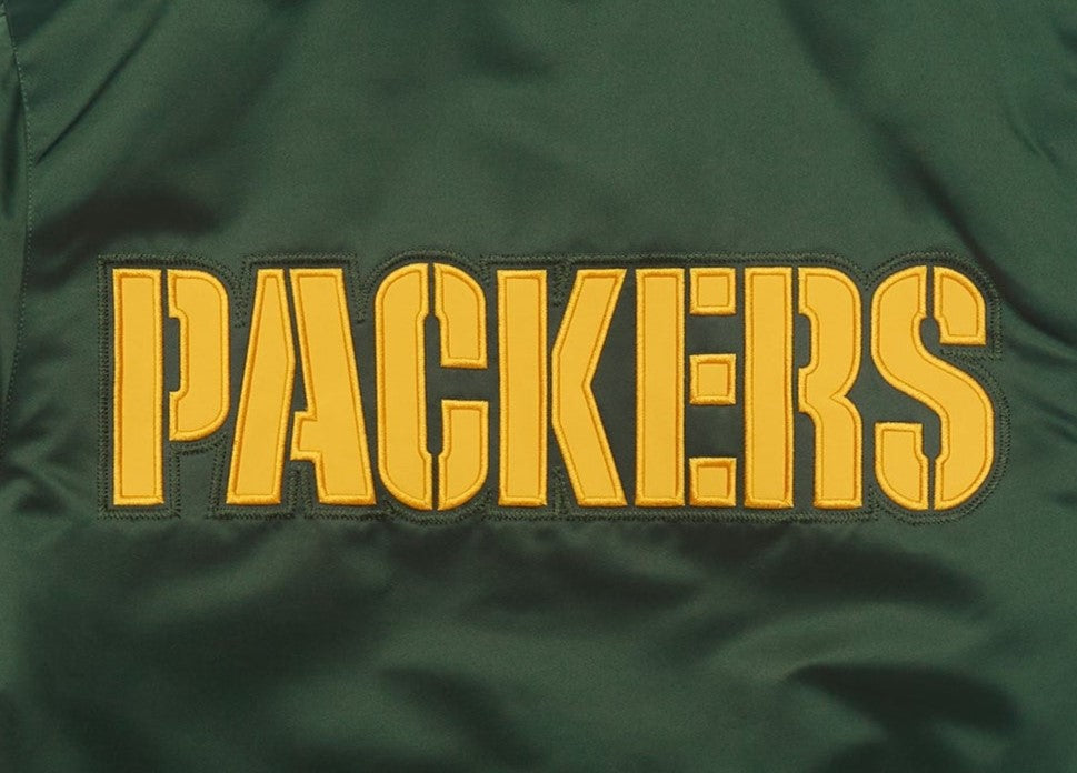 Green Bay Packers jacket with 'Packers' text in yellow on a green background