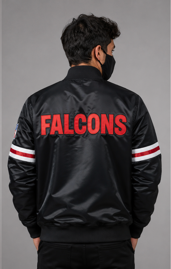 Man wearing the Atlanta Falcons black satin Jacket with the "FALCONS" logo and a grey background
