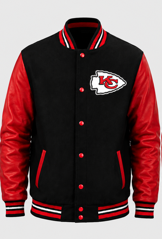 A black and red varsity jacket featuring the Kansas City Chiefs embroidery logo on the left chest, with red leather-look sleeves and striped ribbed collar, cuffs, and hem.