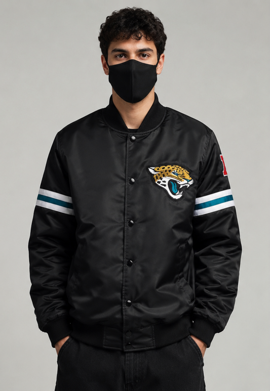 A Men Wearing the Jacksonville Jaguars Black Satin Jacket with team logos with grey background