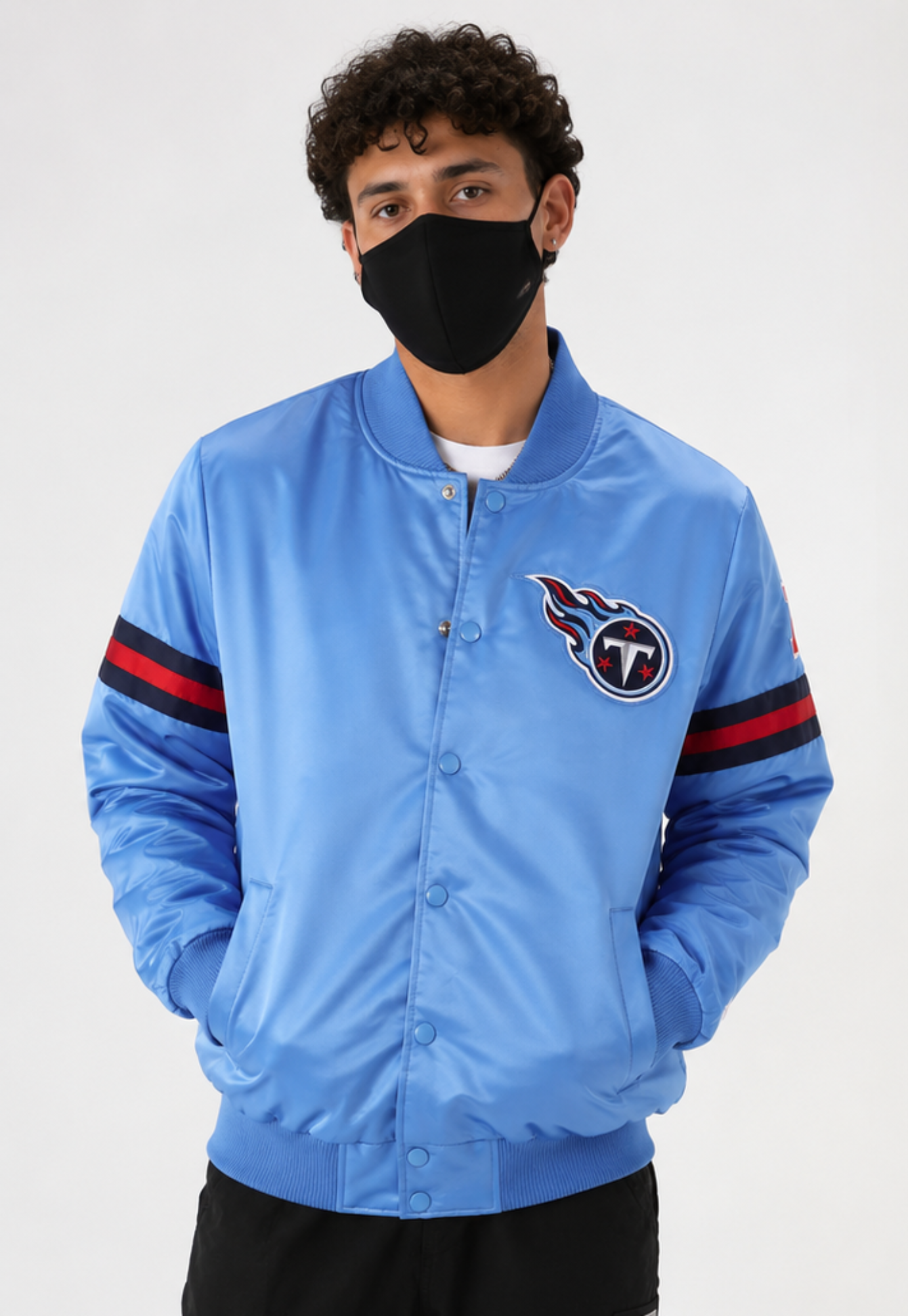 A Men Wearing The Tennessee Titans Light Blue Satin Jacket with team logos with white background