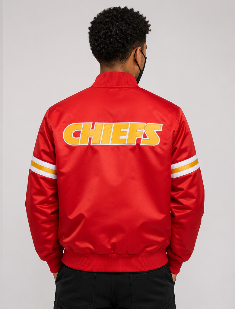 Men Wearing the Kansas City Chiefs Red Satin Jacket with team logos with grey background