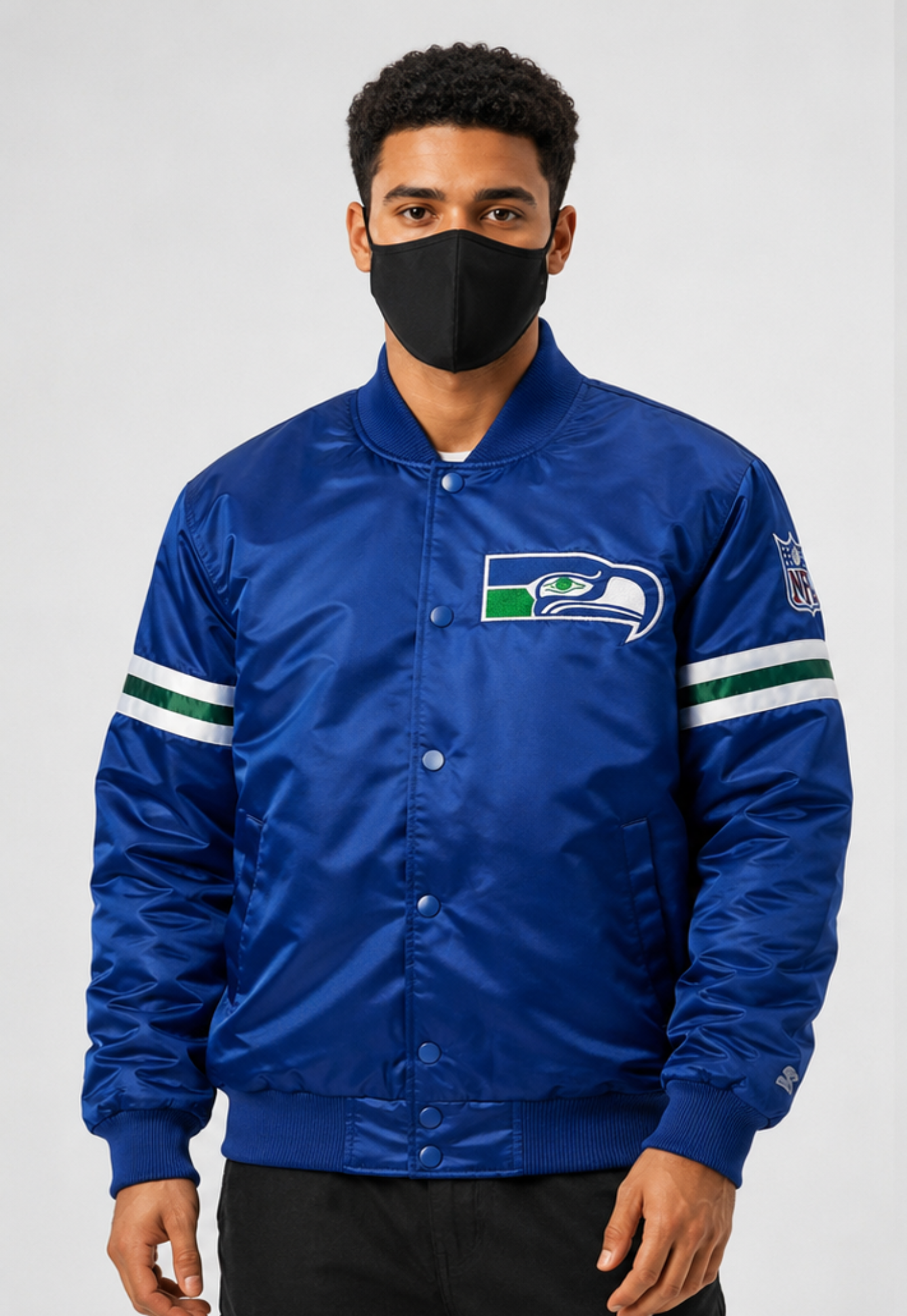A Men Wearing the Seattle Seahawks Royal Blue Satin jacket with team logos with White background