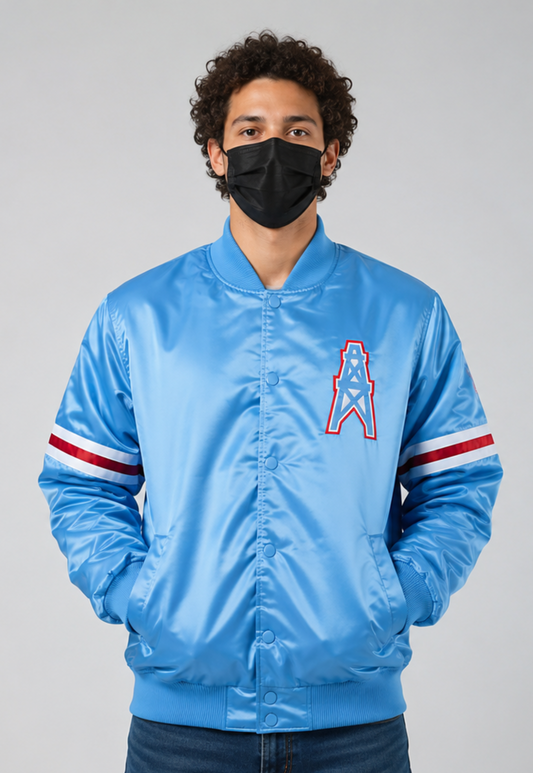 Person wearing a Houston Oilers blue satin jacket with a logo on a gray background