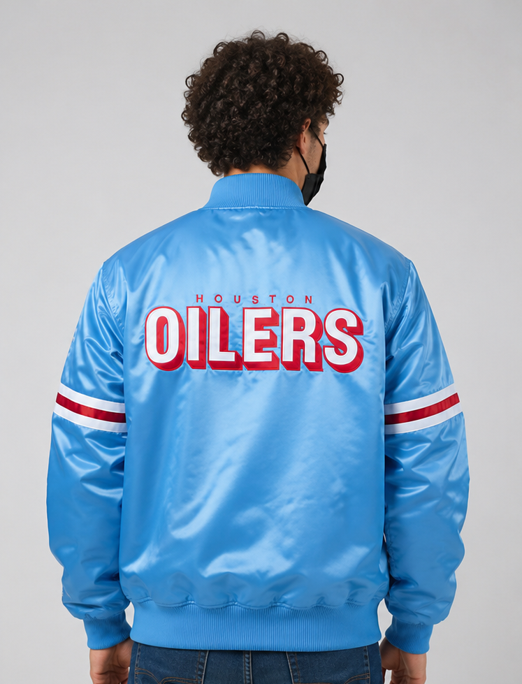 Person wearing a blue Houston Oilers jacket with red and white text on the back.