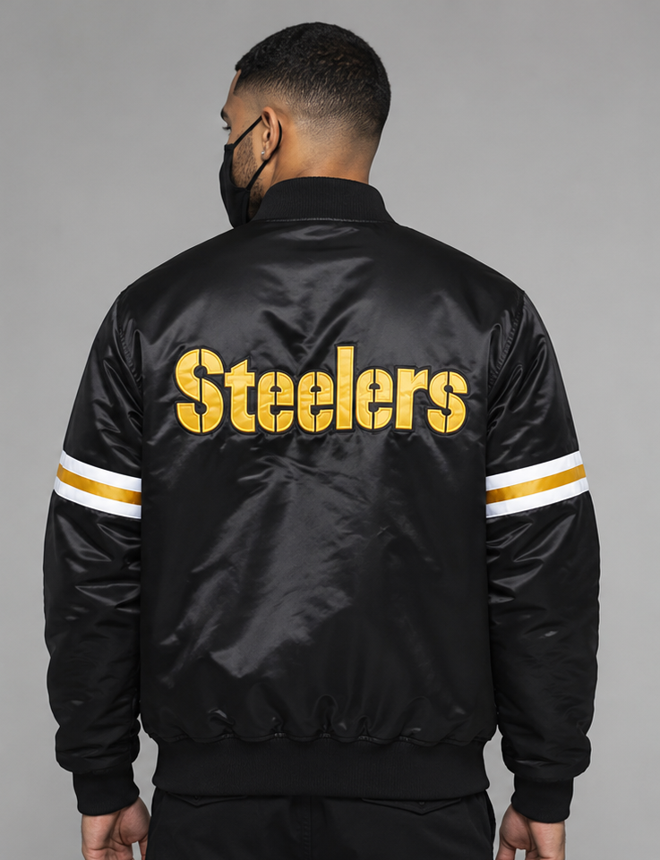 Person wearing a Pittsburgh Steelers black 'Steelers' jacket with yellow lettering on a gray background