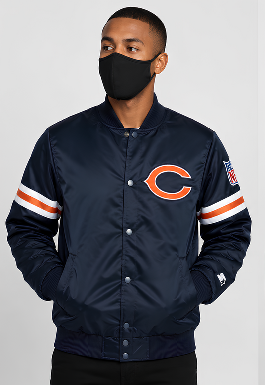 Person wearing a Chicago Bears Navy Satin jacket with a logo on a gray background
