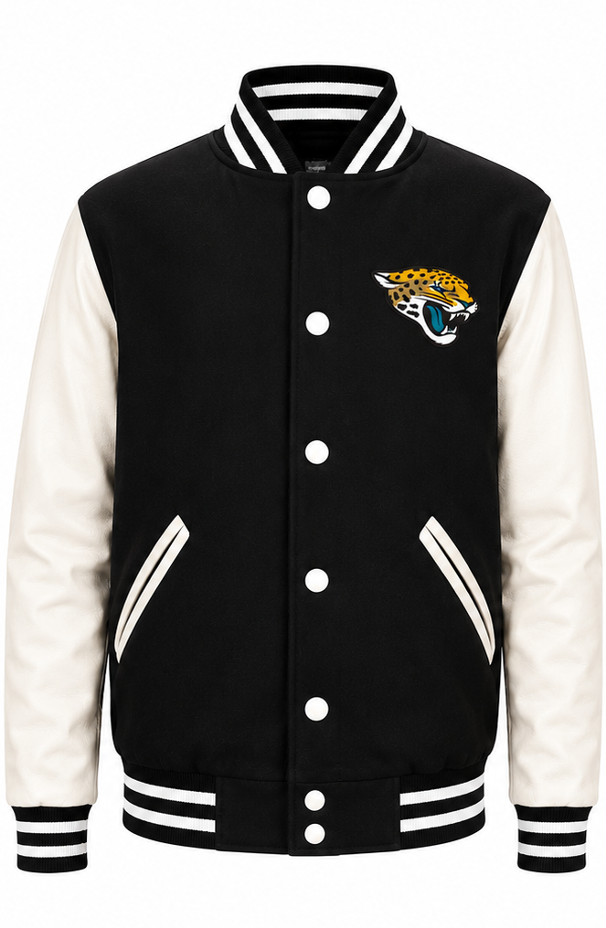 A black and white varsity jacket featuring the Jacksonville Jaguars logo on the left chest, with white buttons, a black and white striped collar, cuffs, and hem, and white leather-look sleeves.