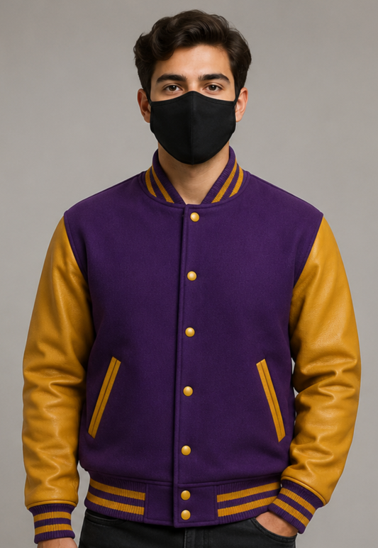 Person wearing a purple and golden varsity jacket with a black mask on a gray background