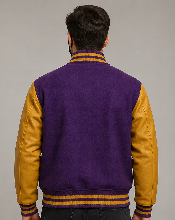 Person wearing a purple and golden varsity jacket on a gray background