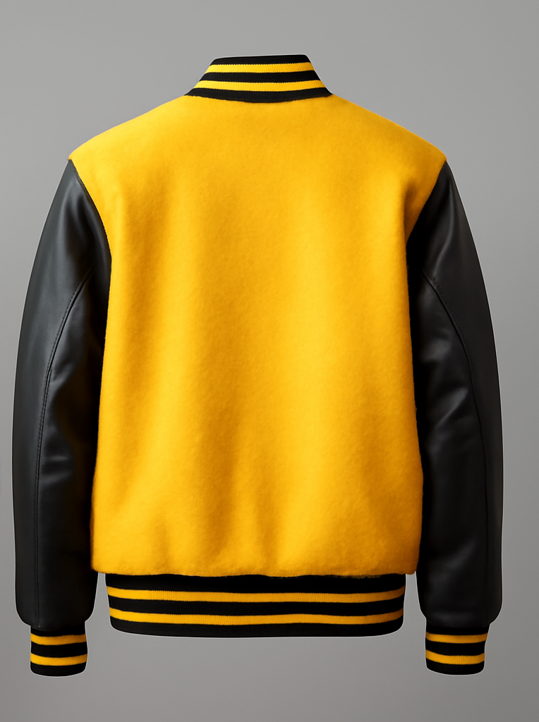Yellow varsity jacket with black sleeves on a gray background