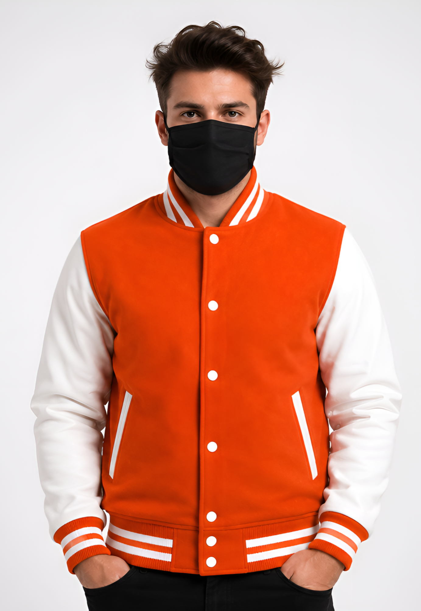 Person wearing an orange and white varsity jacket with a black mask on a white background
