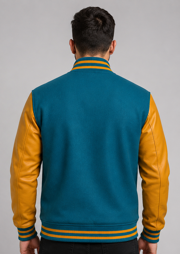 Person wearing a teal and golden varsity jacket on a gray background