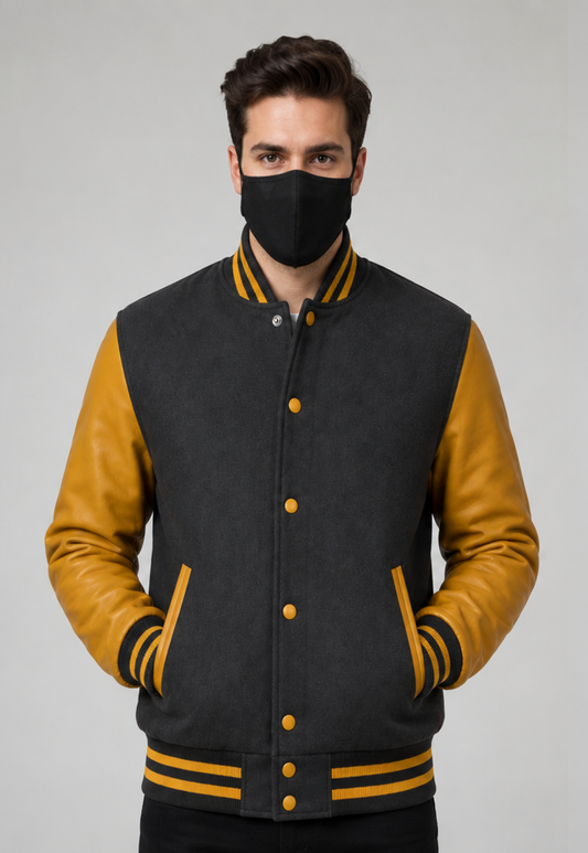 Man wearing a Grey and golden varsity jacket with a face mask on a gray background